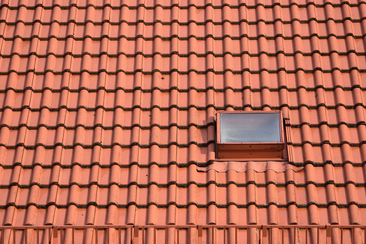 Close-up of professionally laid clay roof tiles on a residential property